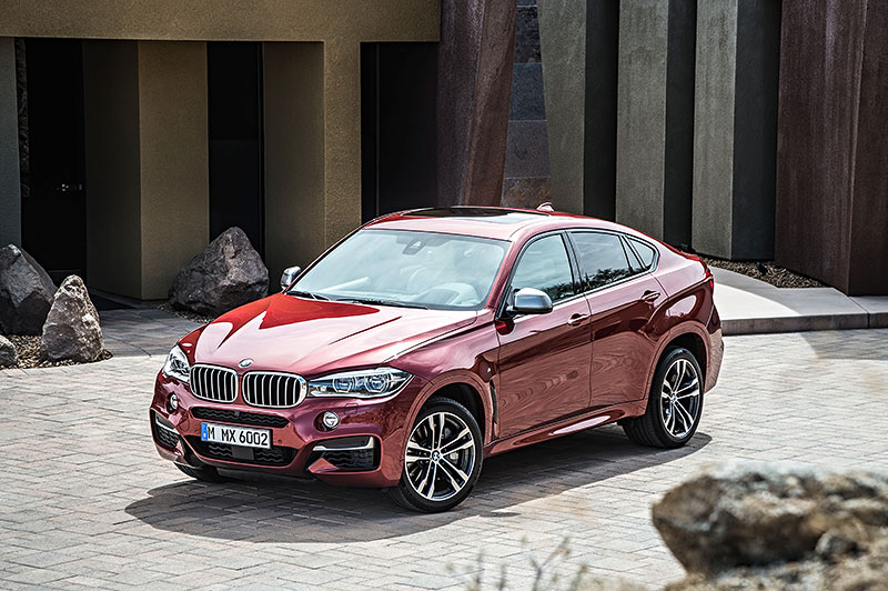 BMW X6 M50d in Flamenco Red