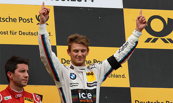 BMW DTM Fahrer Marco Wittmann auf dem Siegerpodest am Nürburgring