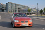 BMW 120d Urban Line (F20) on location in Berlin, im Hintergrund der Hauptbahnhof.