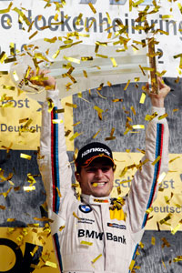 DTM Champion 2012: BMW Fahrer Bruno Spengler auf dem Siegerpodest in Hockenheim