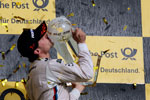 BMW DTM Chamion Brund Spengler mit seinem Siegerpokal