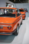 BMW Classic auf der Retro Classics 2022 in Stuttgart: BMW 1602 Elektro aus 1972 vor dem BMW i4 eDrive40